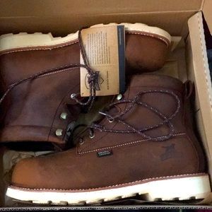 Irish setters by red red wing shoes. They are brand new and never been wore.